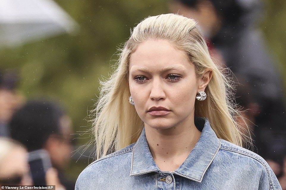 Twinning: Gigi's bright blonde locks were styled in the same way to Bella's - as she added a pair of small but chunky silver earrings