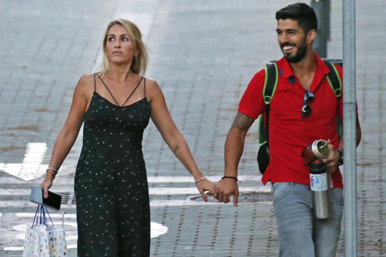  The former Liverpool man was a picture of happiness as he walked hand in hand with wife Sofia Balbi